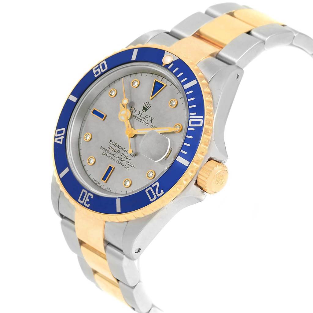 The Rolex Submariner 16613 Men's Steel and Gold (two tone) Grey Dial 16613 Men's Steel and Gold (two tone) Grey Dial watch is shown at a slight angle, highlighting the blue bezel, dial, crown, and part of the bracelet.