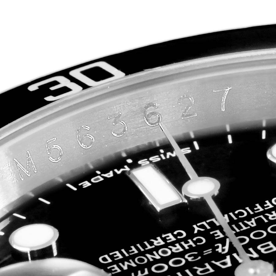 The close-up image shows the serial number and part of the bezel and dial of the Rolex Submariner 16610 Men's Stainless Steel Black Dial 16610 Men's Stainless Steel Black Dial watch.