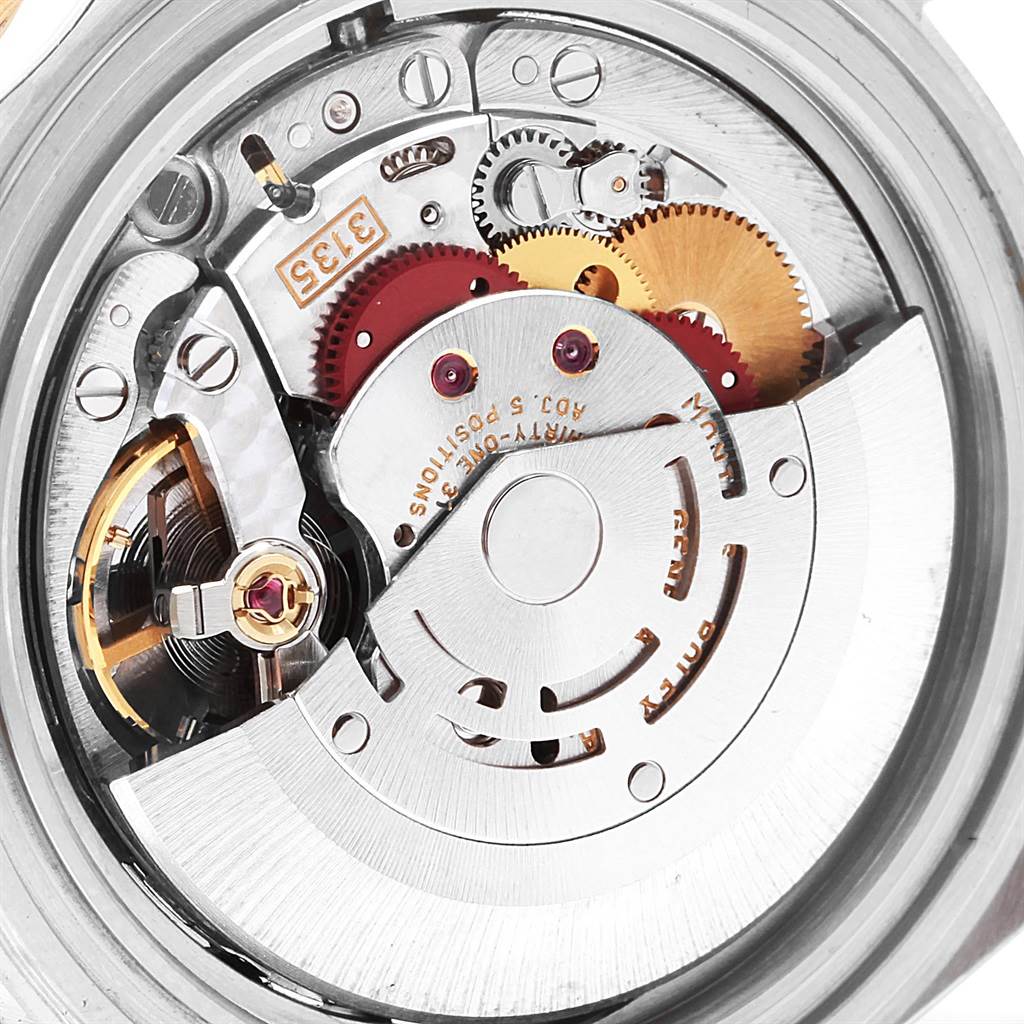 This image shows the intricate internal mechanics of the Rolex Submariner 16613 Men's Steel and Gold (two tone) Blue Dial 16613 Men's Steel and Gold (two tone) Blue Dial model from a back angle, focusing on gears and components.