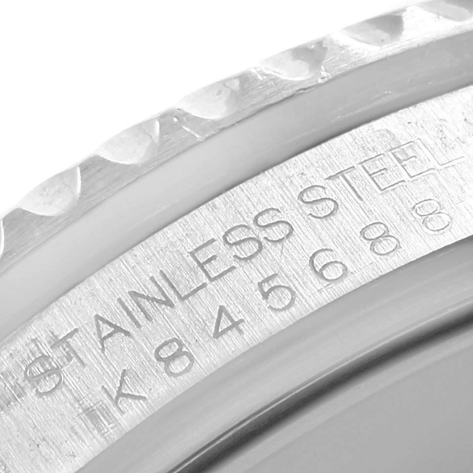This is a close-up shot showing the engraved markings on the bezel and the inner rim of a Rolex Submariner 16610 Men's Stainless Steel Black Dial 16610 Men's Stainless Steel Black Dial watch.