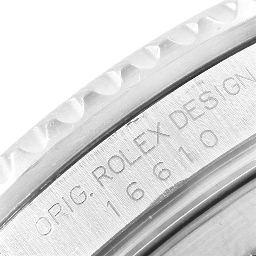 The image shows a close-up of the side of the bezel and engraved case of a Rolex Submariner 16610 Men's Stainless Steel Black Dial 16610 Men's Stainless Steel Black Dial watch.