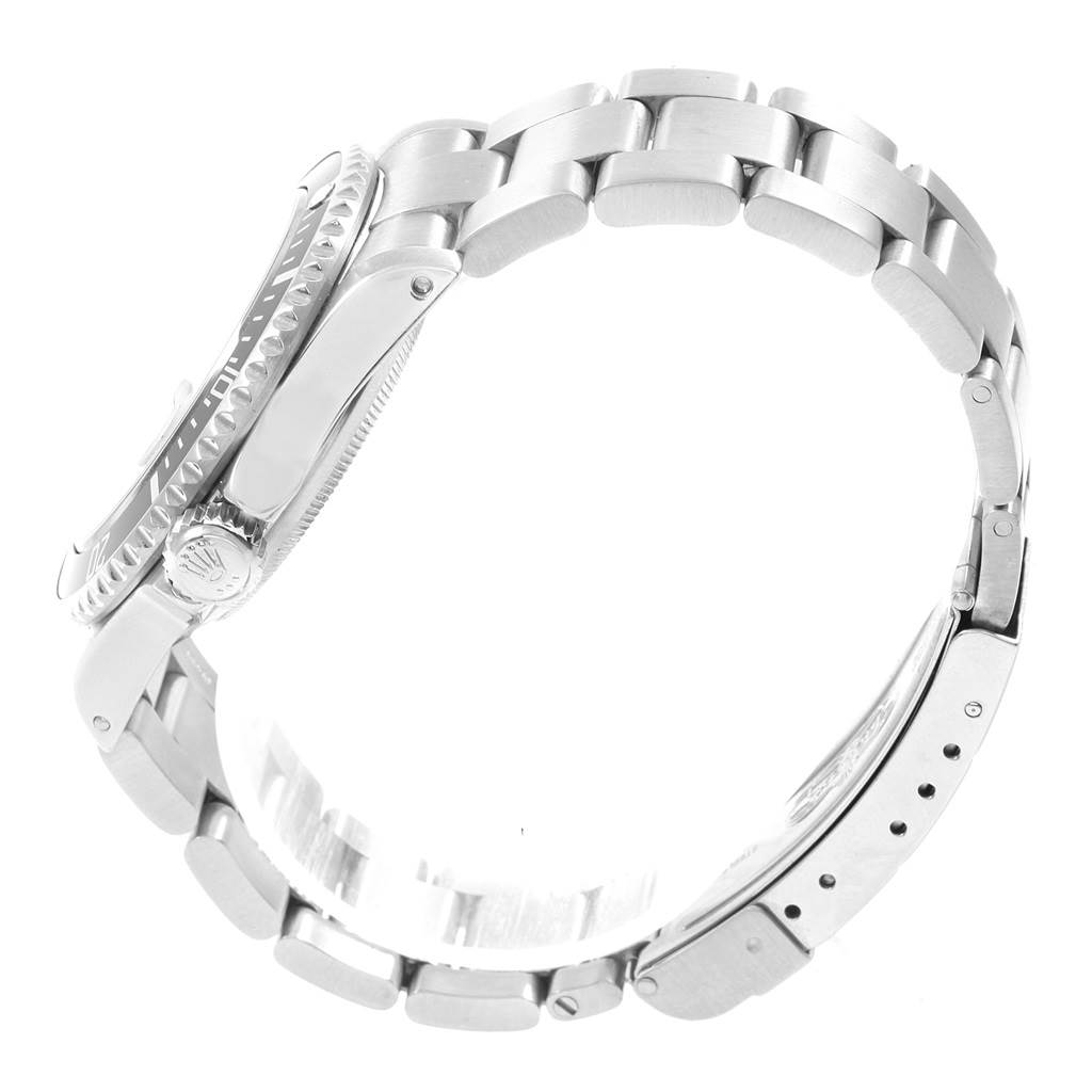 The image shows a side view of a Rolex Submariner 16610 Men's Stainless Steel Black Dial 16610 Men's Stainless Steel Black Dial watch, highlighting its case, bezel, crown, and bracelet.