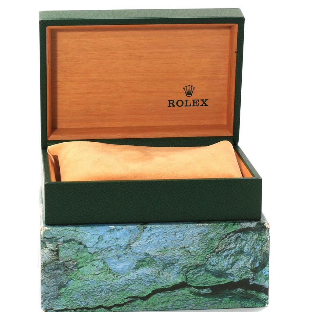 The image shows an open Rolex Submariner 16610 Men's Stainless Steel Black Dial 16610 Men's Stainless Steel Black Dial watch box, revealing the inner cushion and brand logo inside the lid.