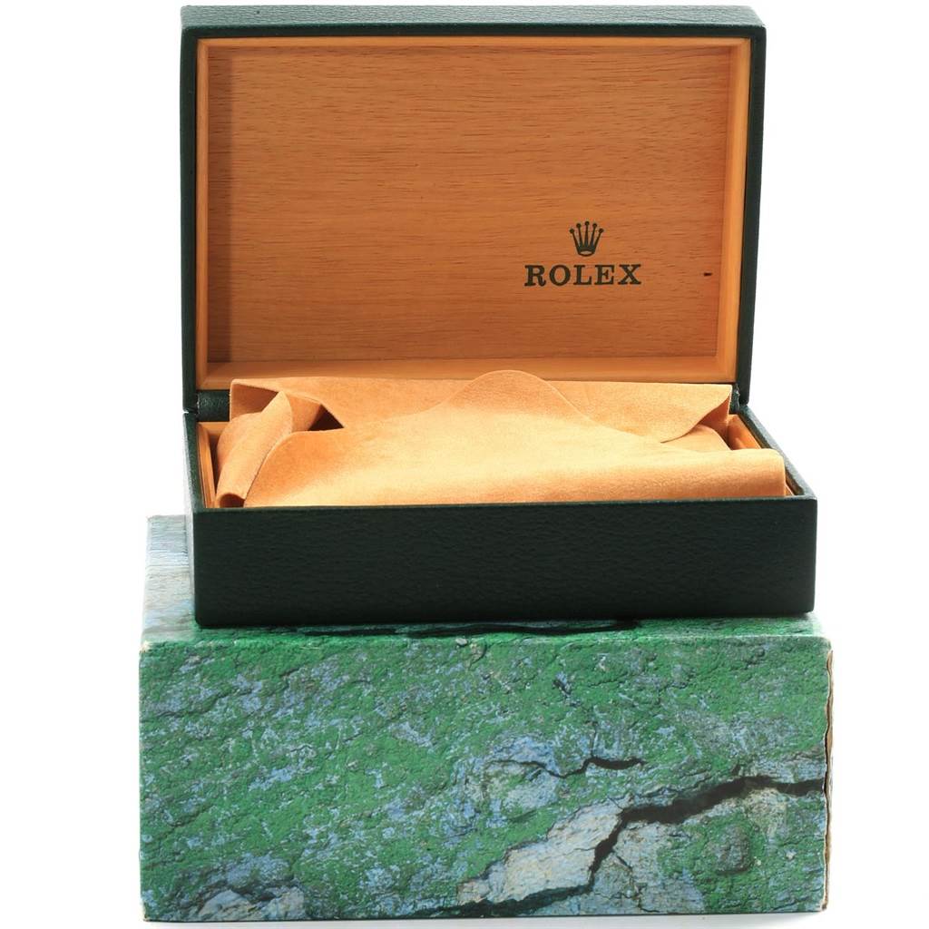 The image shows an open Rolex box without the Submariner model watch inside, revealing the interior lining and cushion.