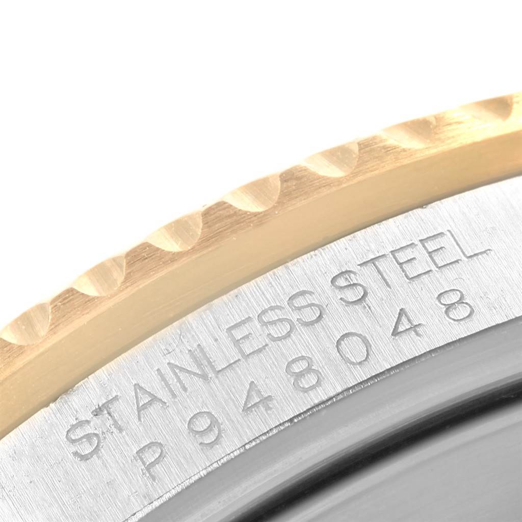 The close-up image shows the stainless steel casing and part of the bezel of a Rolex Submariner 16613 Men's Steel and Gold (two tone) Blue Dial 16613 Men's Steel and Gold (two tone) Blue Dial watch.