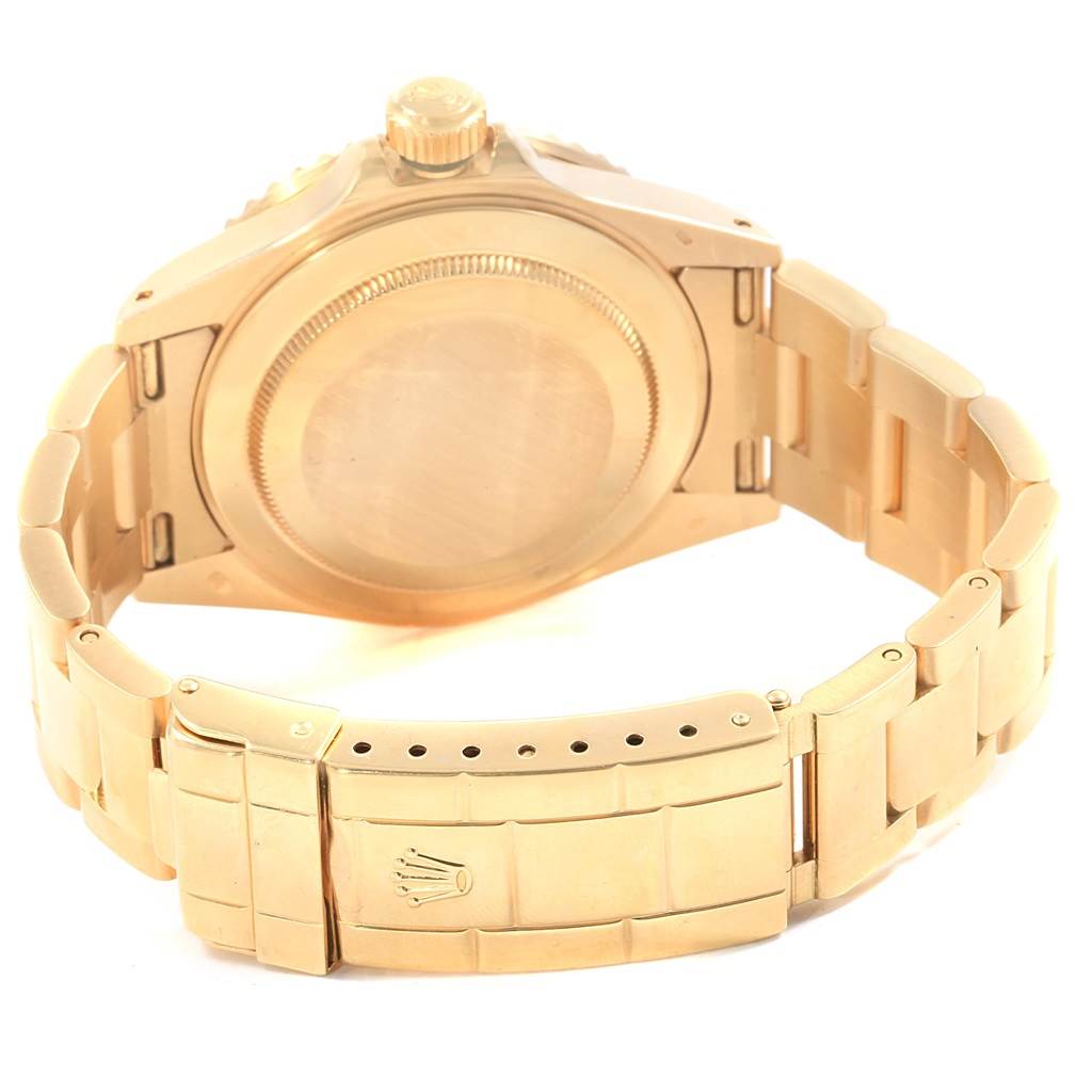 The image shows the back casing and bracelet of a Rolex Submariner 16618 Men's Yellow Gold Purple Dial 16618 Men's Yellow Gold Purple Dial watch, with the Rolex crown logo visible on the clasp.