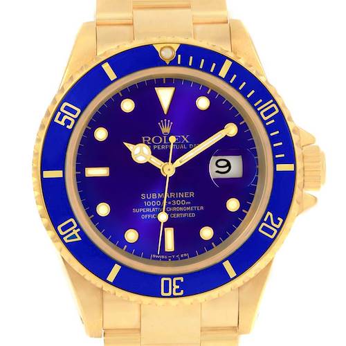 This image shows a front view of the Rolex Submariner 16618 Men's Yellow Gold Purple Dial 16618 Men's Yellow Gold Purple Dial, displaying its blue dial, date window, and gold bezel.