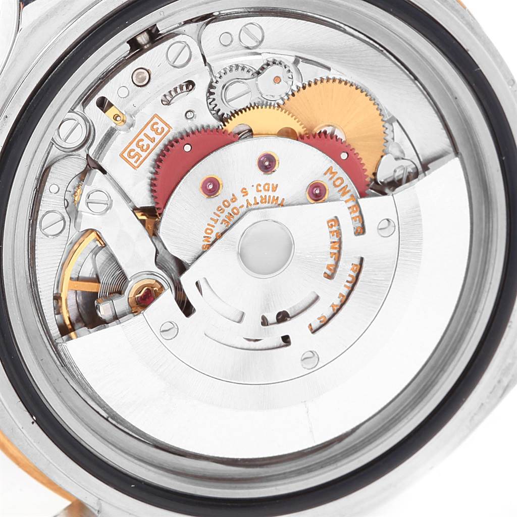 This image shows a close-up view of the movement (internal mechanism) of a Rolex Submariner 16613 Men's Steel and Gold (two tone) Black Dial 16613 Men's Steel and Gold (two tone) Black Dial watch.