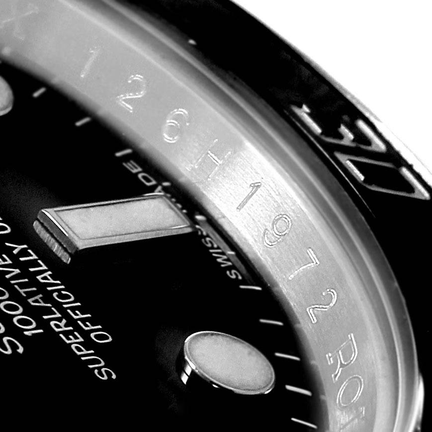 This image shows a close-up of the dial and the inner bezel of a Rolex Submariner 116610 Men's Stainless Steel Black Dial 116610 Men's Stainless Steel Black Dial watch.