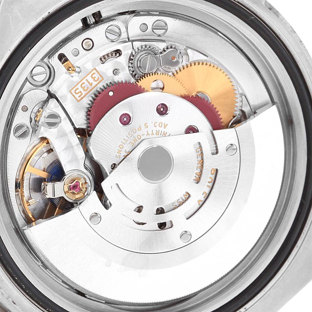 This image shows the internal mechanical movement of a Rolex Submariner 116610 Men's Stainless Steel Black Dial 116610 Men's Stainless Steel Black Dial watch, highlighting its intricate gears and components.