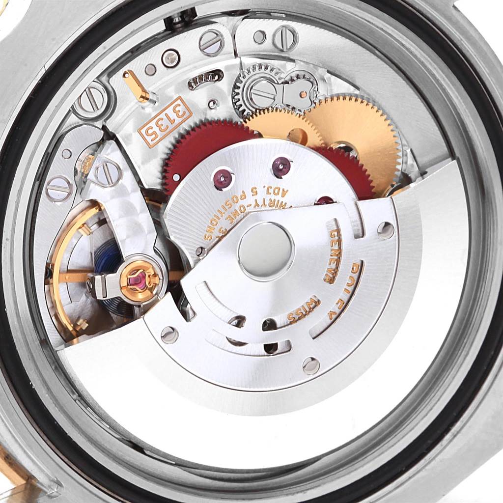 This image shows a close-up view of the Rolex Submariner 116613 Men's Steel and Gold (two tone) Black Dial 116613 Men's Steel and Gold (two tone) Black Dial's movement, focusing on its intricate internal mechanisms.