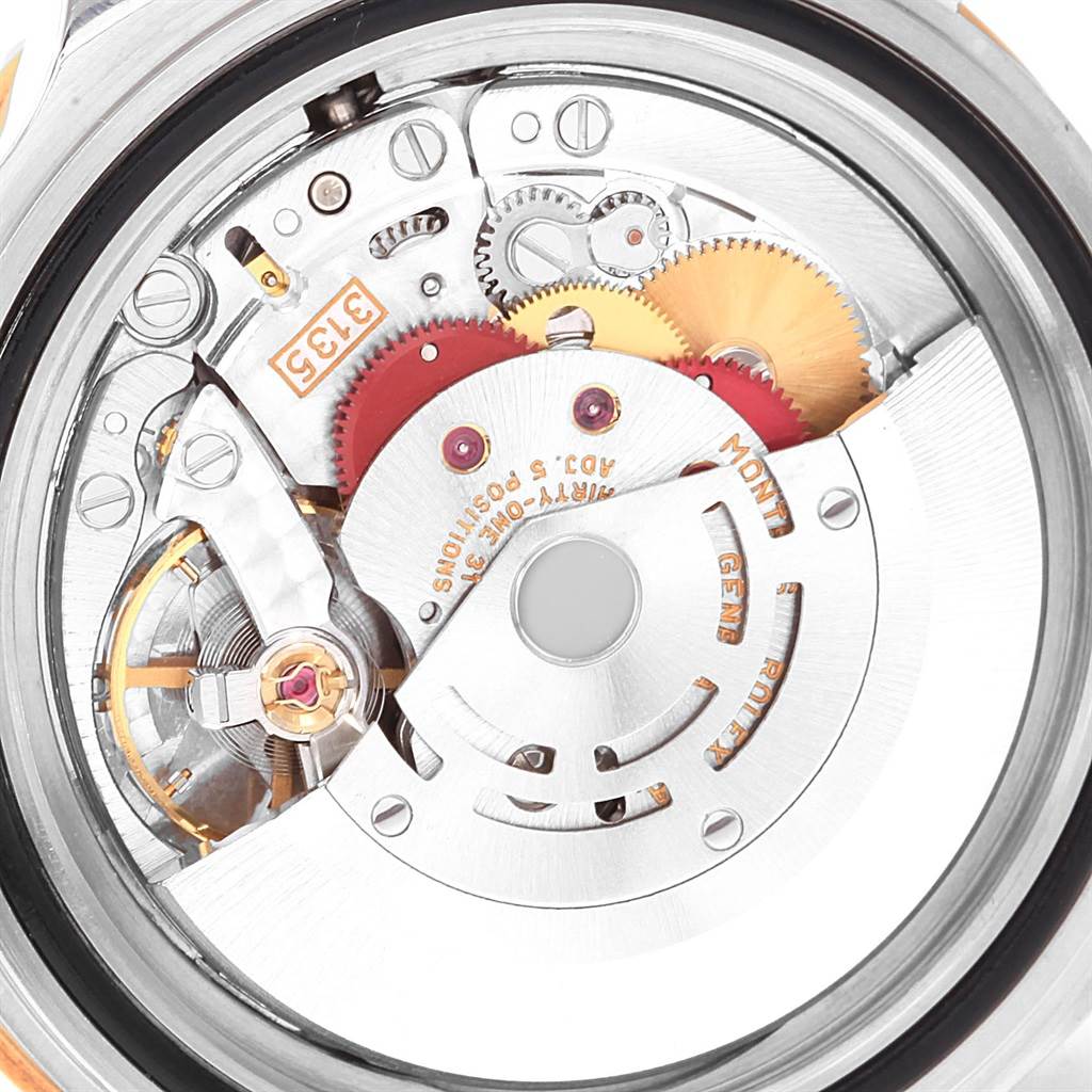 This image shows the internal mechanism, or movement, of a Rolex Submariner 16613 Men's Steel and Gold (two tone) Black Dial 16613 Men's Steel and Gold (two tone) Black Dial watch from a rear angle.