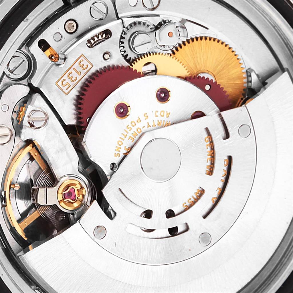 The image shows the inner mechanical movement of the Rolex Submariner 16613 Men's Steel and Gold (two tone) Black Dial 16613 Men's Steel and Gold (two tone) Black Dial watch, highlighting gears and other components.