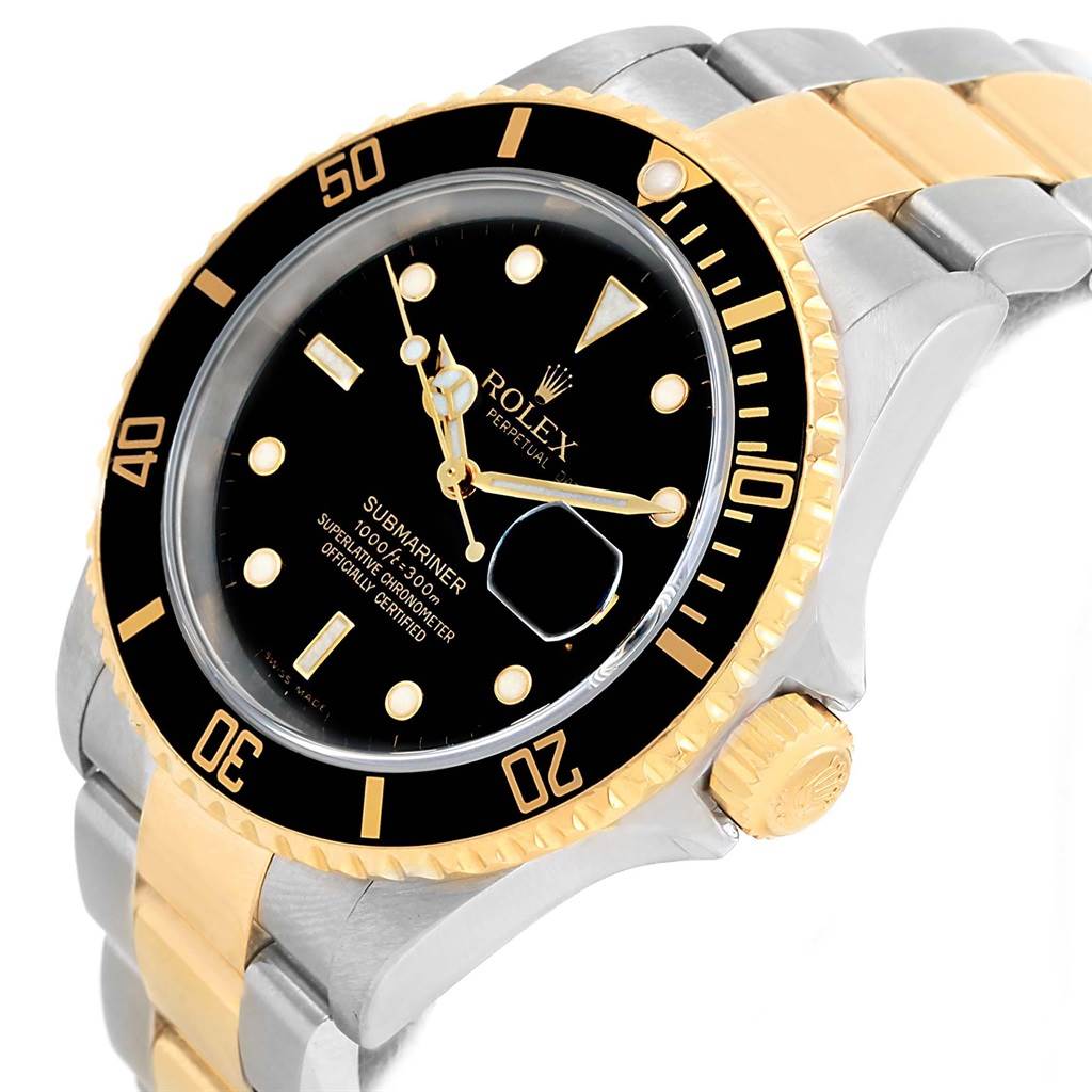This image shows a close-up of the Rolex Submariner 16613 Men's Steel and Gold (two tone) Black Dial 16613 Men's Steel and Gold (two tone) Black Dial watch, highlighting the bezel, crown, and part of the bracelet from a tilted angle.