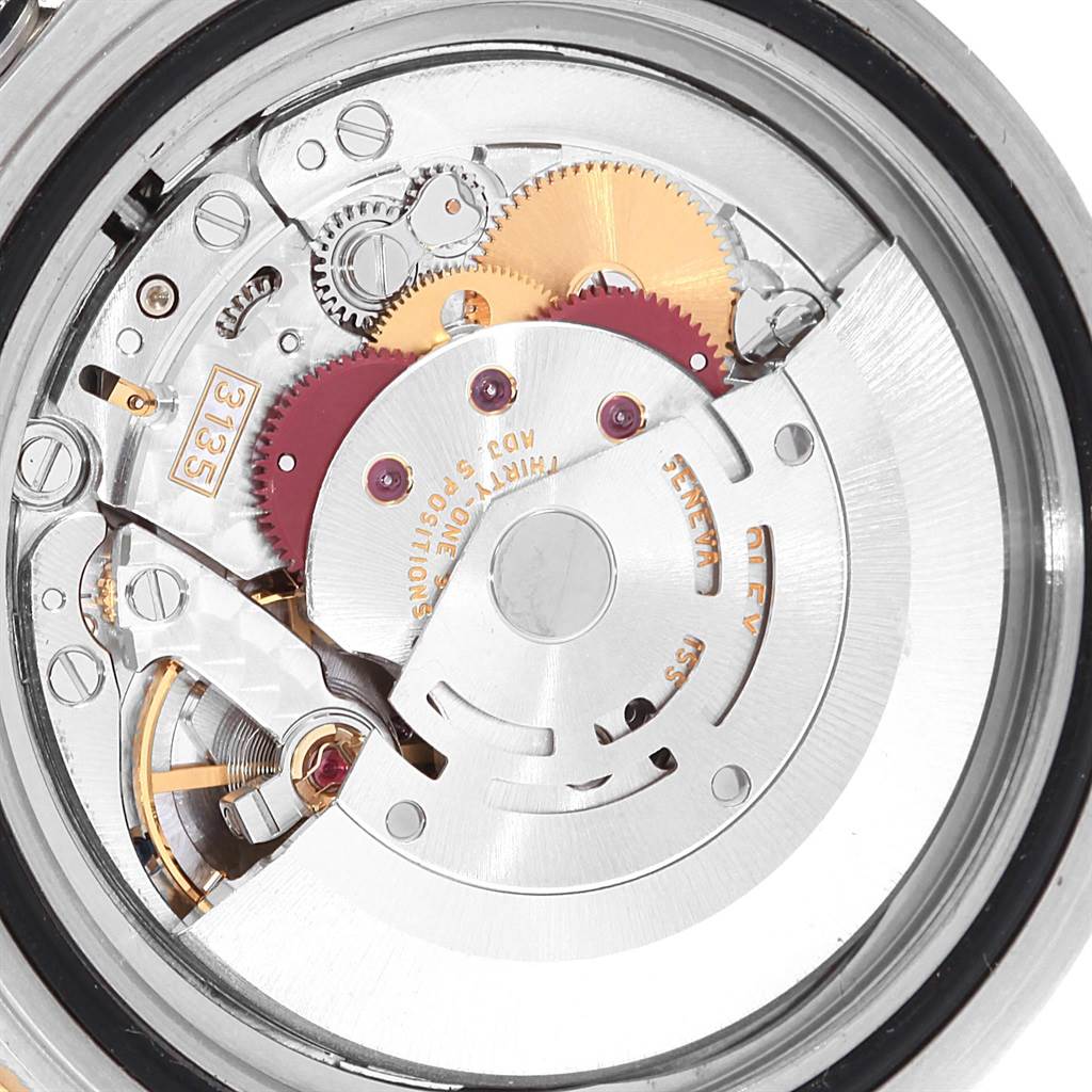 This close-up image shows the intricate internal mechanism of the Rolex Submariner 16613 Men's Steel and Gold (two tone) Blue Dial 16613 Men's Steel and Gold (two tone) Blue Dial watch.
