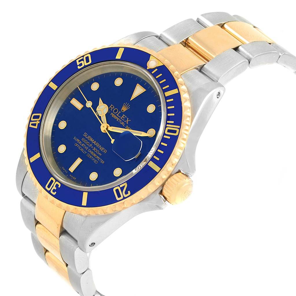 This image shows a tilted angle of a Rolex Submariner 16613 Men's Steel and Gold (two tone) Blue Dial 16613 Men's Steel and Gold (two tone) Blue Dial watch highlighting its blue dial, gold bezel, and two-tone bracelet.