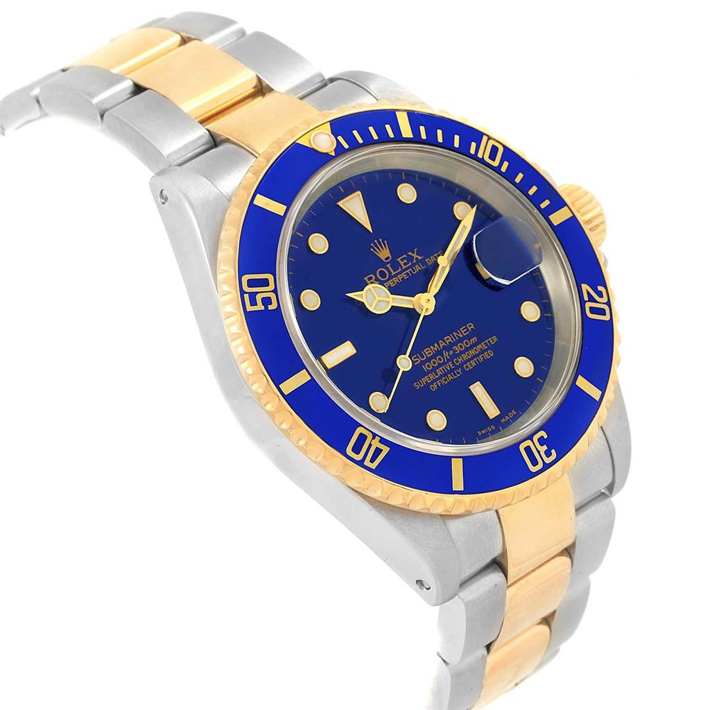 The Rolex Submariner 16613 Men's Steel and Gold (two tone) Blue Dial 16613 Men's Steel and Gold (two tone) Blue Dial is shown at a slight angle, displaying the blue dial, bezel, and two-tone bracelet.