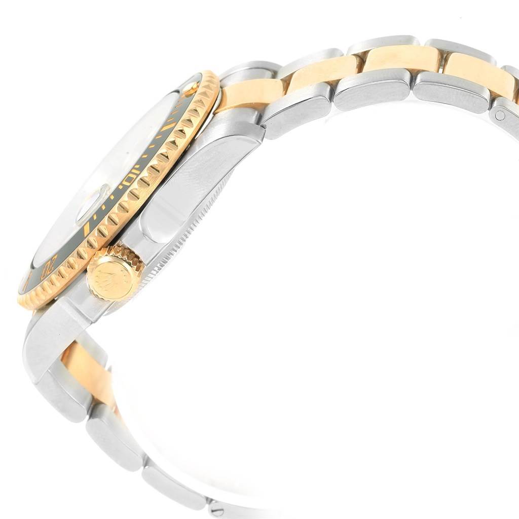 The image shows a side view of a Rolex Submariner 116613 Men's Steel and Gold (two tone) Black Dial 116613 Men's Steel and Gold (two tone) Black Dial watch, highlighting its bezel, crown, and two-tone bracelet.