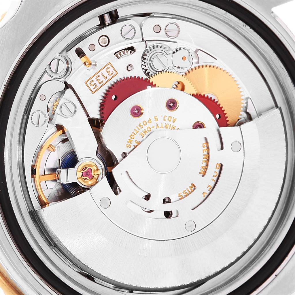 The image shows a close-up view of the movement mechanism inside a Rolex Submariner 116613 Men's Steel and Gold (two tone) Black Dial 116613 Men's Steel and Gold (two tone) Black Dial watch.