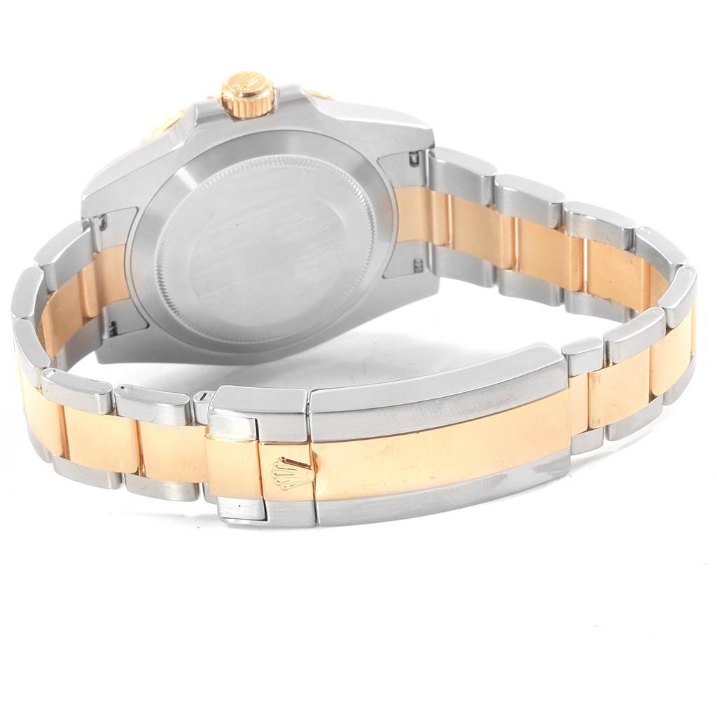 The image shows the back and bracelet of a Rolex Submariner 116613 Men's Steel and Gold (two tone) Black Dial 116613 Men's Steel and Gold (two tone) Black Dial, highlighting its two-tone metal design.