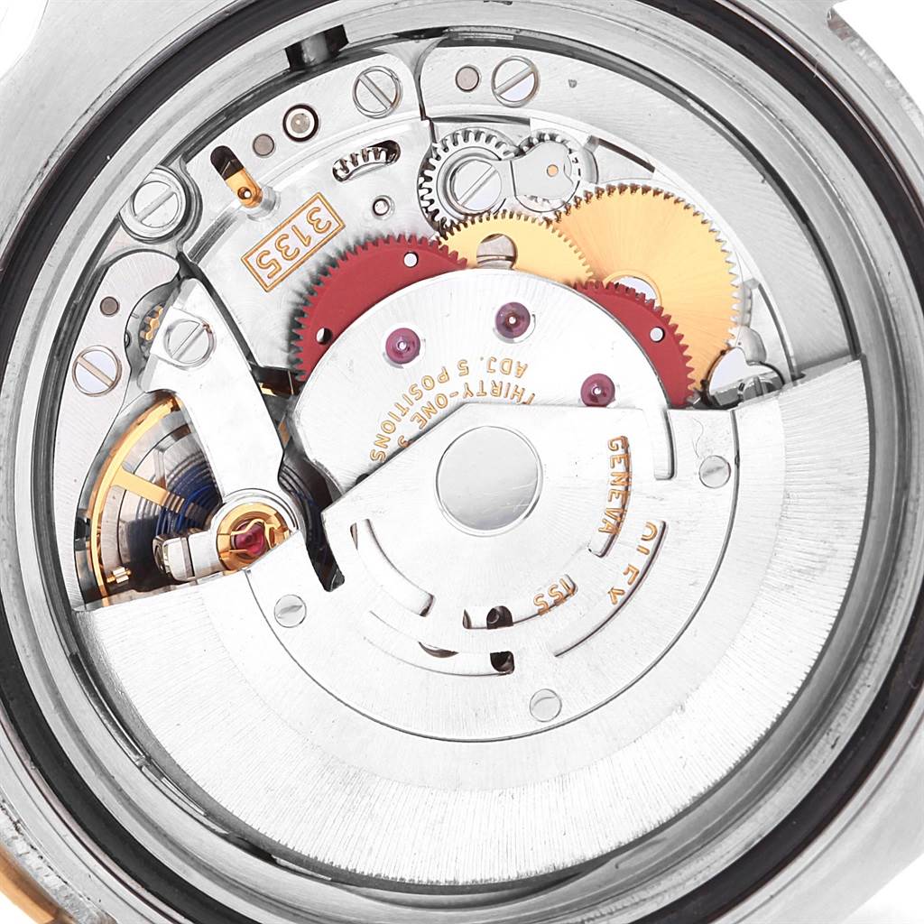 This image shows the internal mechanical movement of a Rolex Submariner 116613 Men's Steel and Gold (two tone) Black Dial 116613 Men's Steel and Gold (two tone) Black Dial timepiece from an overhead angle.