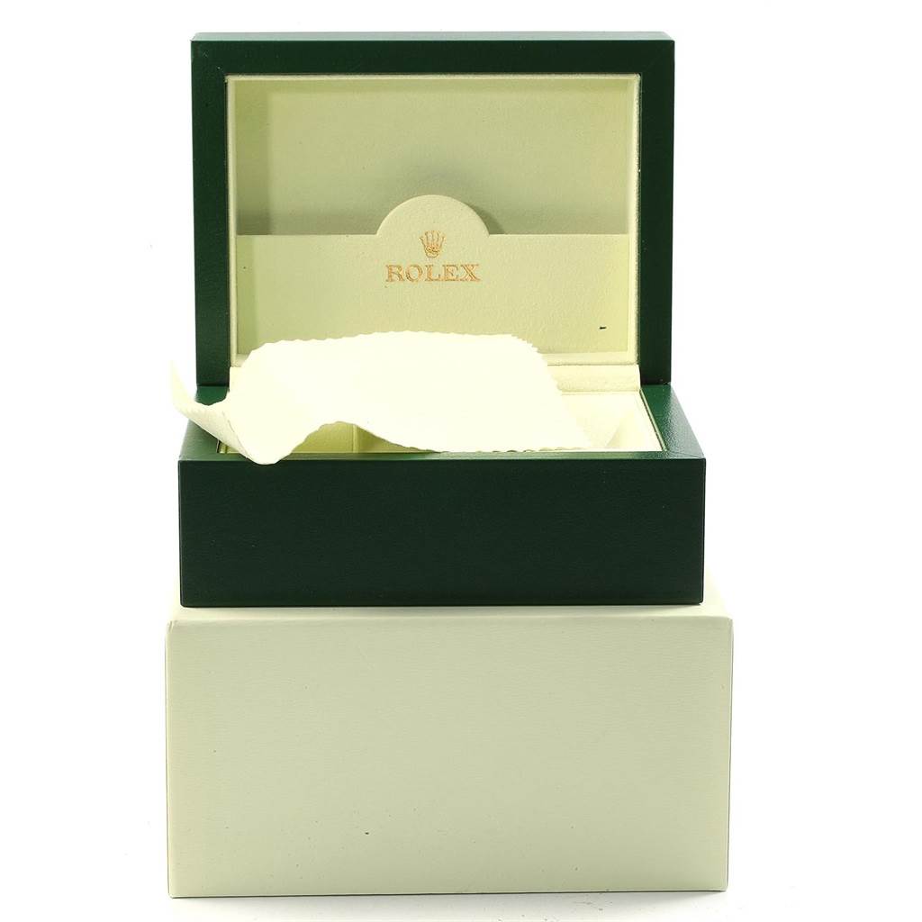 The image shows an open green and cream Rolex Submariner 16613 Men's Steel and Gold (two tone) Champagne Dial 16613 Men's Steel and Gold (two tone) Champagne Dial watch box with a cloth inside, viewed from the front.