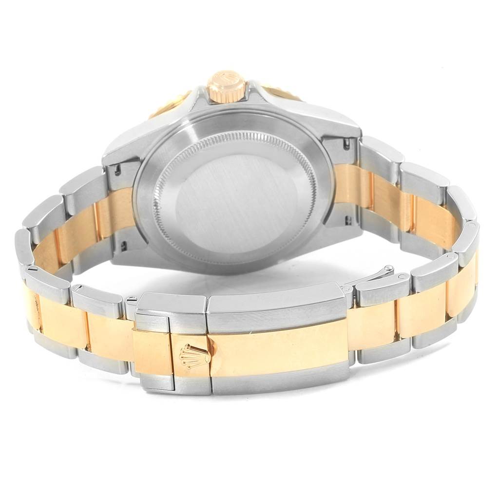 The image shows the back and bracelet of a Rolex Submariner 16613 Men's Steel and Gold (two tone) Champagne Dial 16613 Men's Steel and Gold (two tone) Champagne Dial watch, highlighting the two-tone metal design.