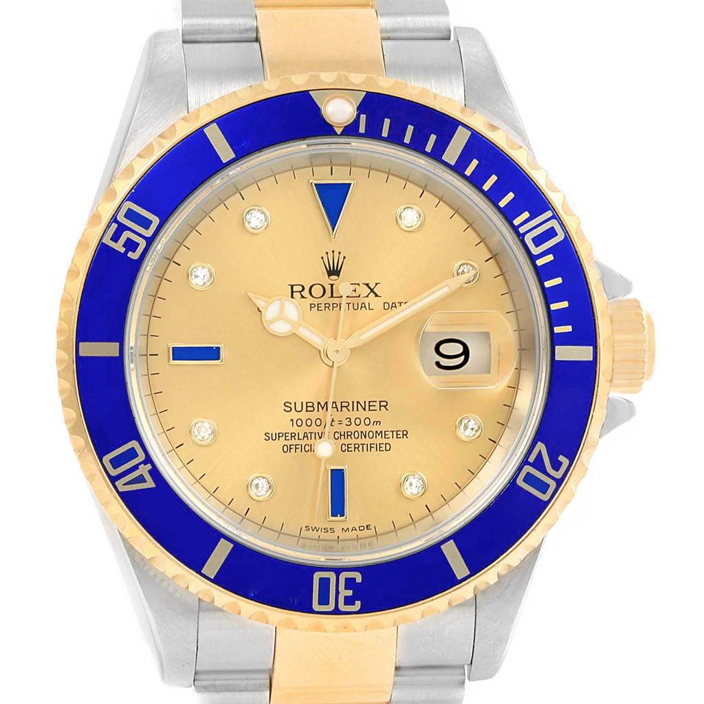 The image shows the front view of a Rolex Submariner 16613 Men's Steel and Gold (two tone) Champagne Dial 16613 Men's Steel and Gold (two tone) Champagne Dial watch, highlighting its bezel, dial, hands, and date window.