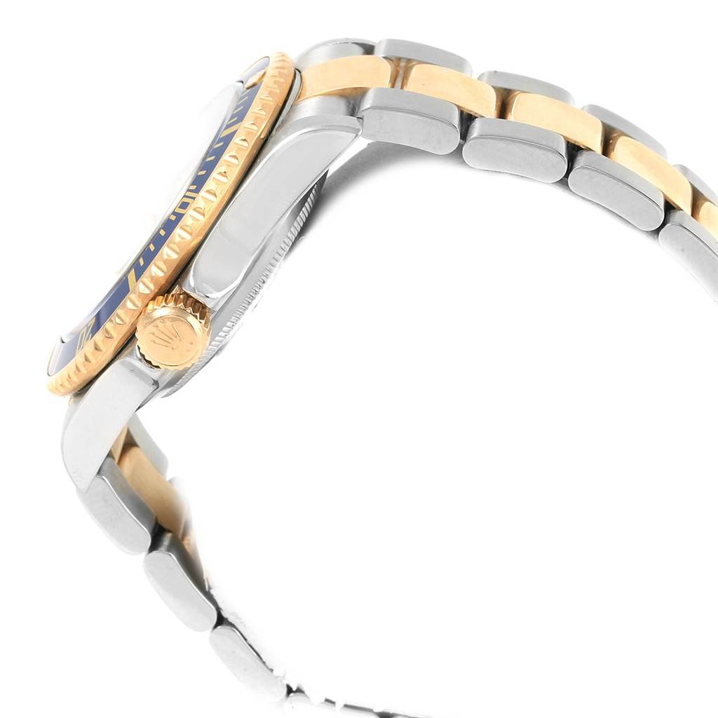 This image shows a side view of the Rolex Submariner 16613 Men's Steel and Gold (two tone) Champagne Dial 16613 Men's Steel and Gold (two tone) Champagne Dial watch, highlighting its bezel, crown, and two-tone bracelet.