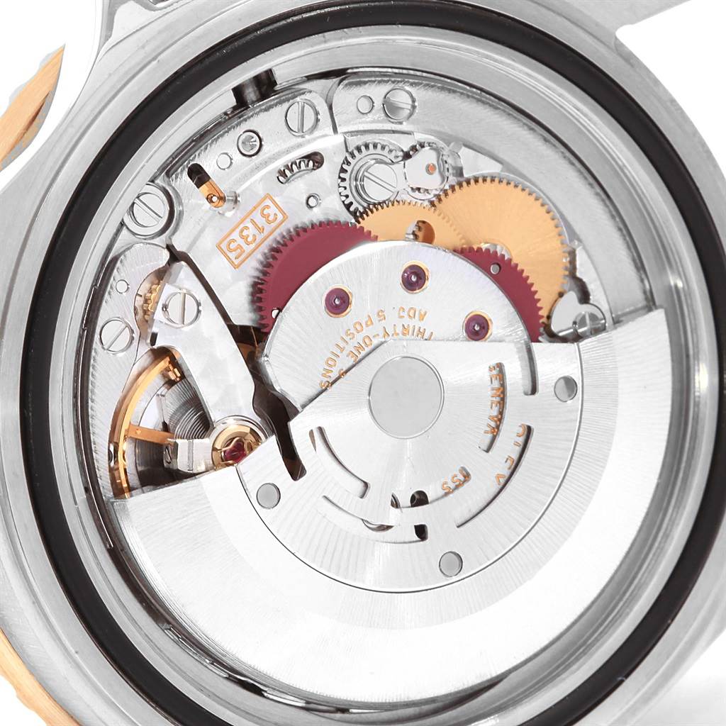This image shows a close-up of the internal mechanism of a Rolex Submariner 16613 Men's Steel and Gold (two tone) Black Dial 16613 Men's Steel and Gold (two tone) Black Dial watch.