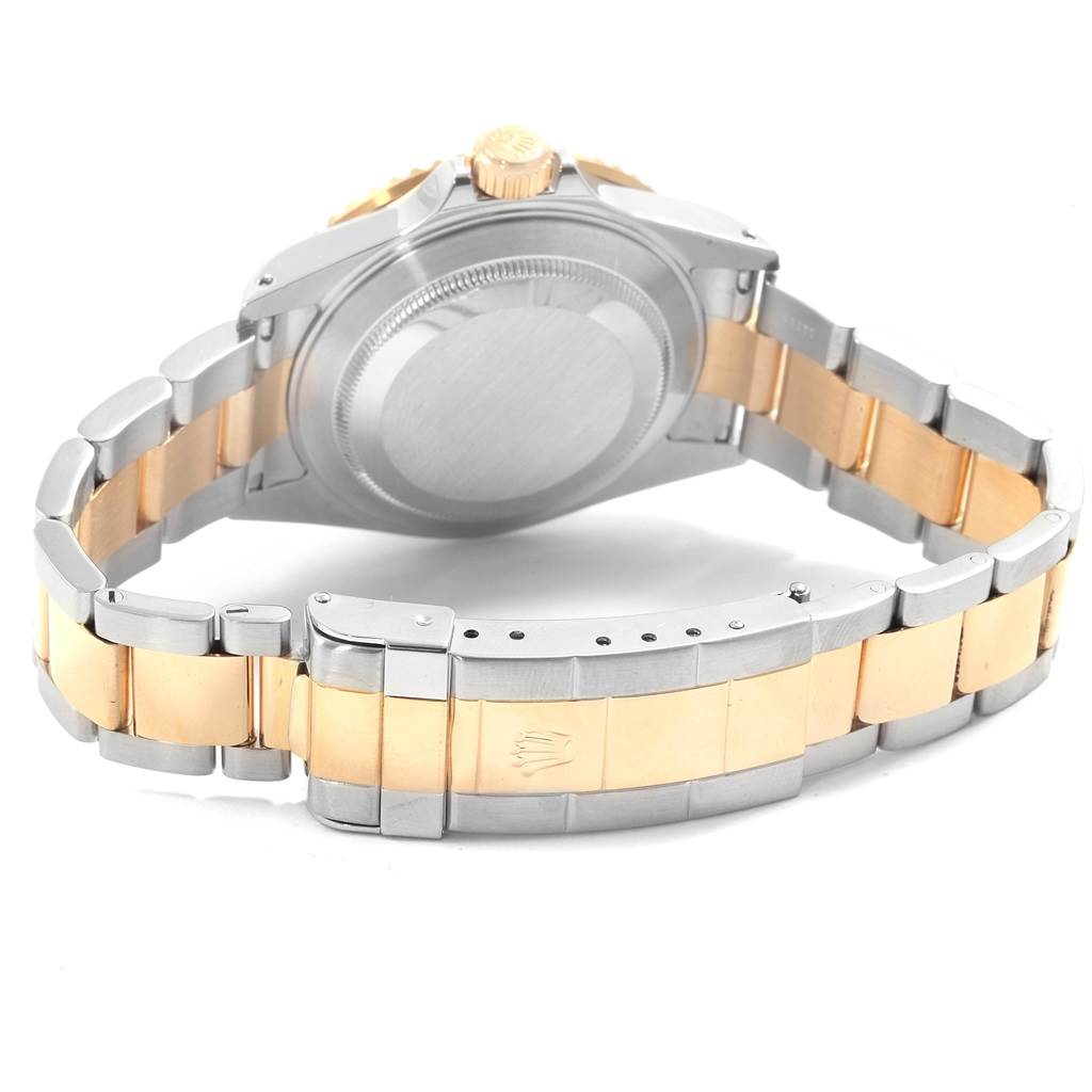 The image shows the back angle of a Rolex Submariner 16613 Men's Steel and Gold (two tone) Black Dial 16613 Men's Steel and Gold (two tone) Black Dial watch, highlighting the bracelet and case back.