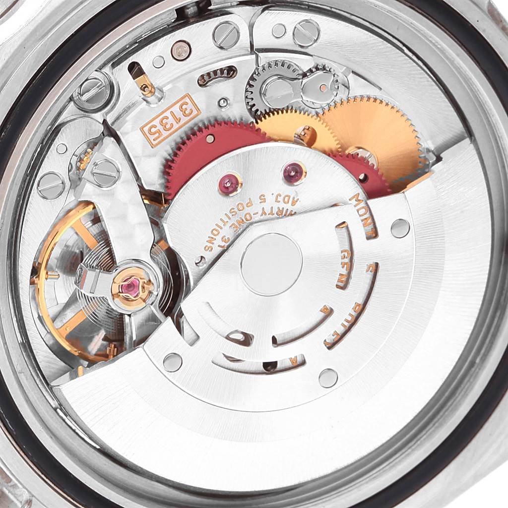 The image shows a close-up view of the movement and internal mechanisms of a Rolex Submariner 16610 Men's Stainless Steel Black Dial 16610 Men's Stainless Steel Black Dial watch.