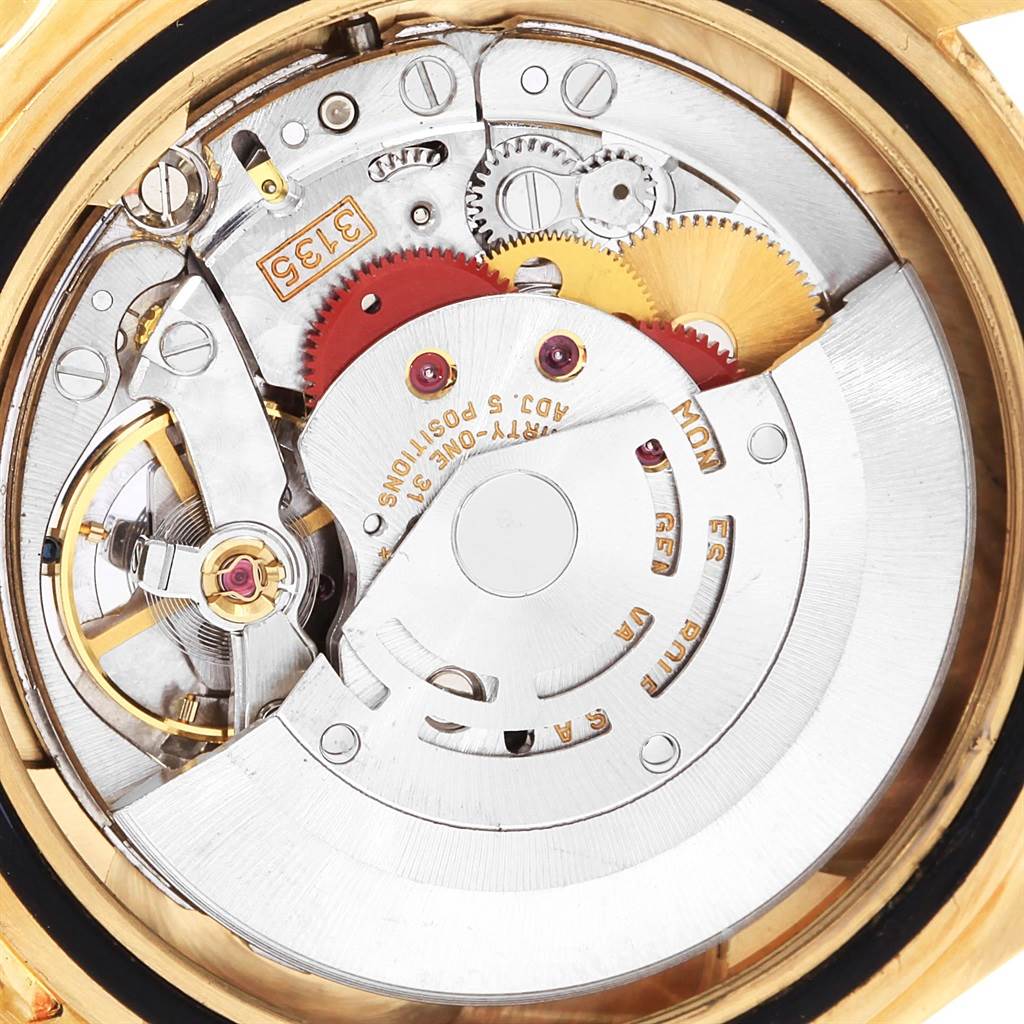 This image shows the internal mechanism, including gears and movement, of a Rolex Submariner 16618 Men's Yellow Gold Champagne Dial 16618 Men's Yellow Gold Champagne Dial watch from the back.
