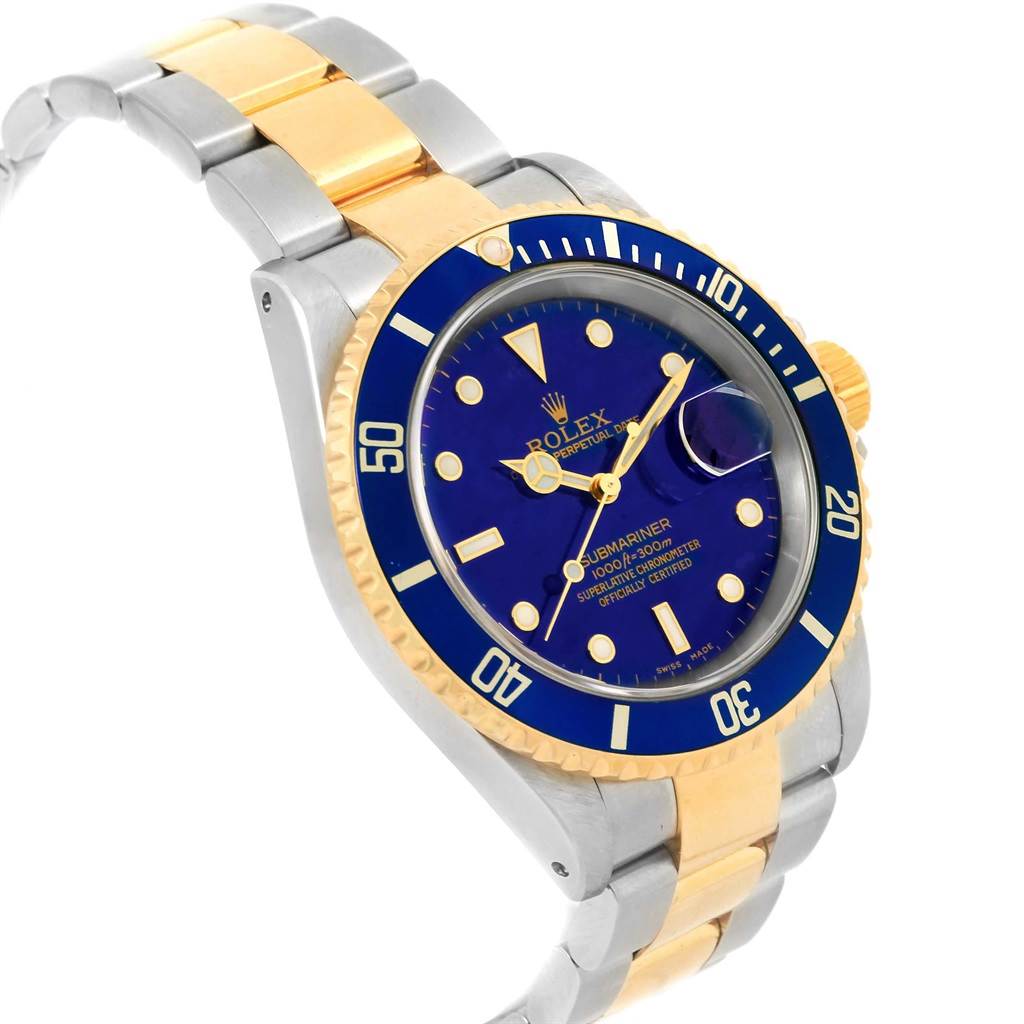 This image shows a Rolex Submariner 16613 Men's Steel and Gold (two tone) Blue Dial 16613 Men's Steel and Gold (two tone) Blue Dial watch at an angled side view, displaying the bracelet, face, and bezel.