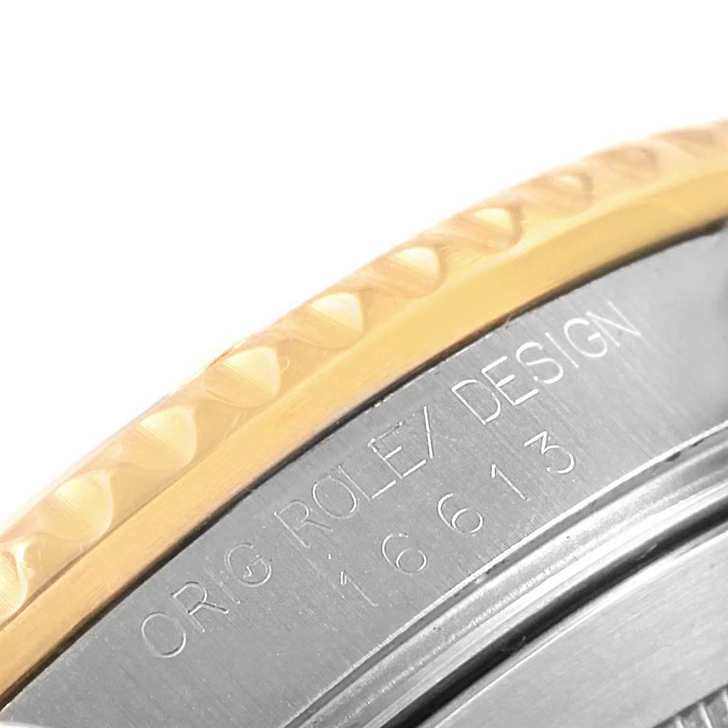 The image shows a close-up of the bezel and case side of a Rolex Submariner 16613 Men's Steel and Gold (two tone) Blue Dial 16613 Men's Steel and Gold (two tone) Blue Dial, displaying the model number engraving.