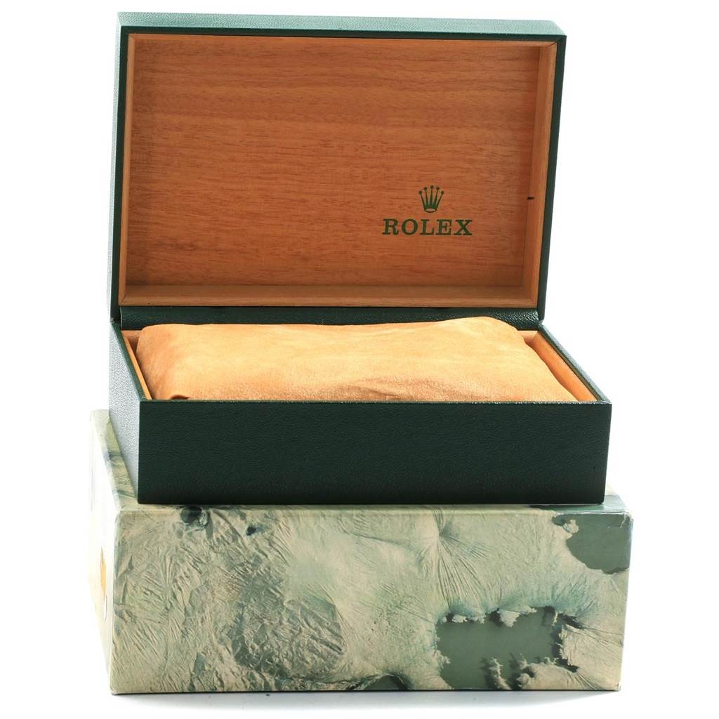 This image shows an open Rolex Submariner 16613 Men's Steel and Gold (two tone) Blue Dial 16613 Men's Steel and Gold (two tone) Blue Dial watch box with a cushion inside, viewed from the front.