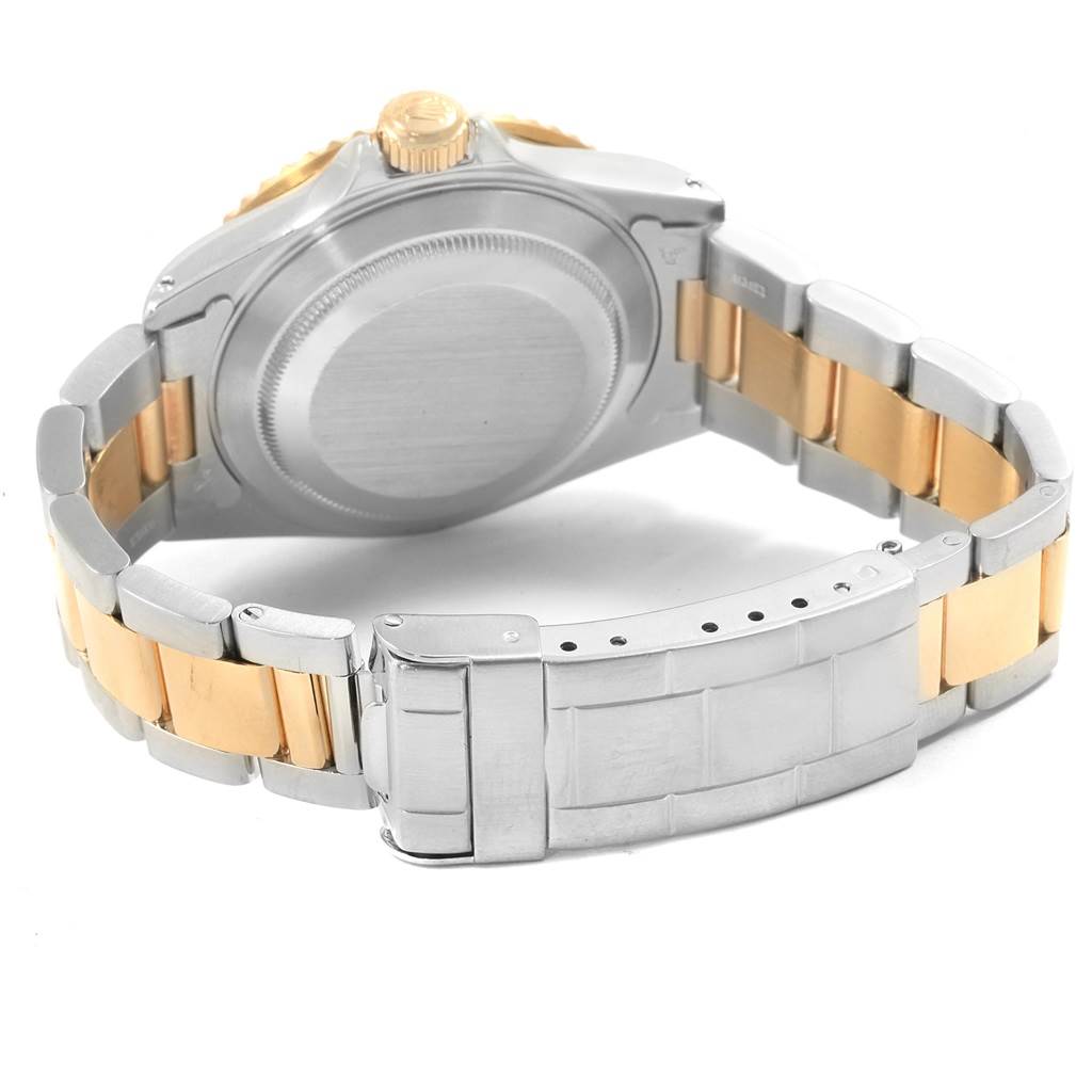 The image shows the back case and bracelet clasp of a Rolex Submariner 16613 Men's Steel and Gold (two tone) Blue Dial 16613 Men's Steel and Gold (two tone) Blue Dial watch in a stainless steel and gold finish.