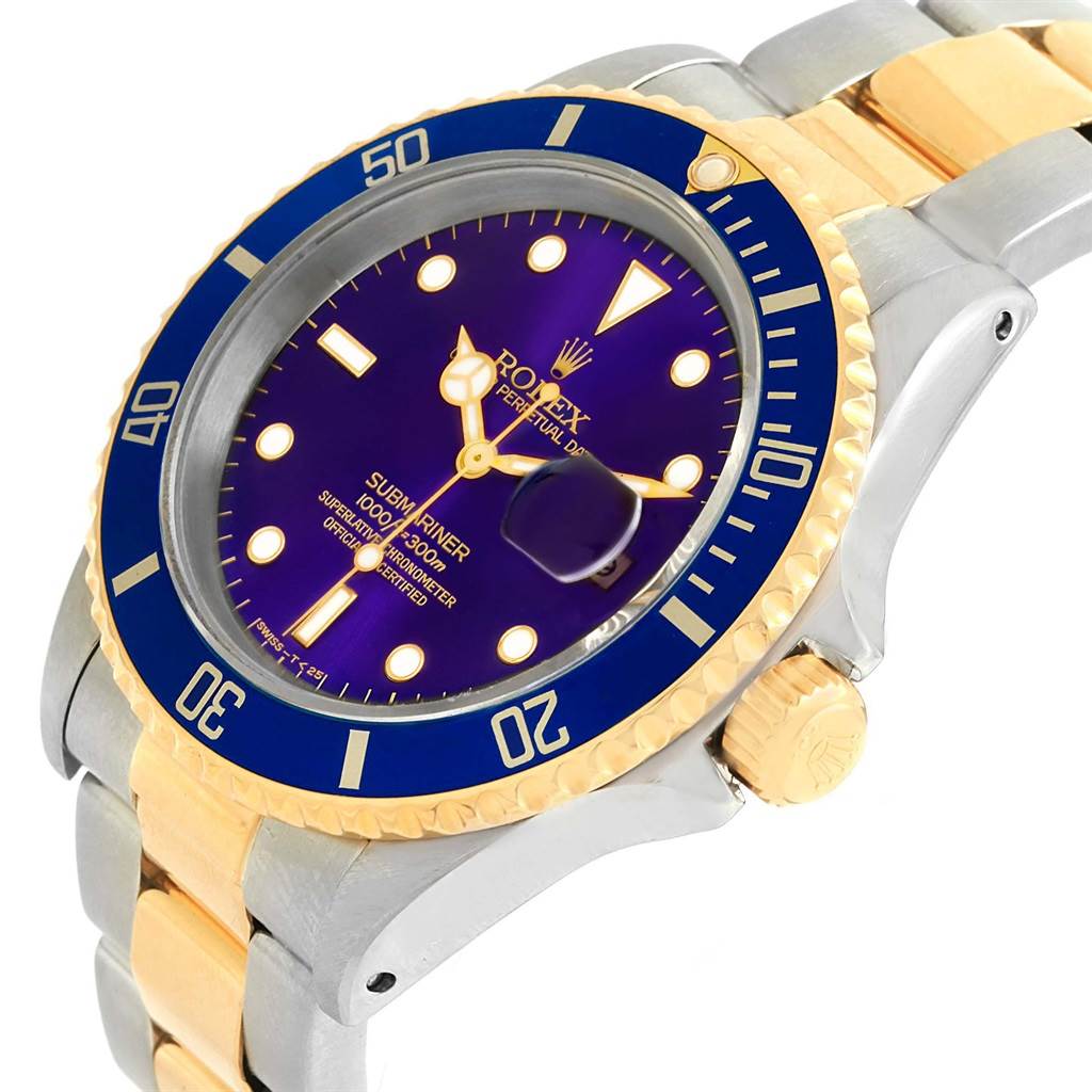 The image shows a Rolex Submariner 16613 Men's Steel and Gold (two tone) Blue Dial 16613 Men's Steel and Gold (two tone) Blue Dial watch from an angled top view, highlighting its dial, bezel, and crown.