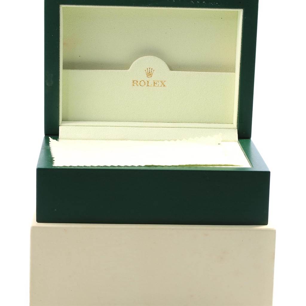 This image shows an open Rolex Submariner 16610 Men's Stainless Steel Black Dial 16610 Men's Stainless Steel Black Dial watch box from a front angle, displaying the interior with the Rolex logo.