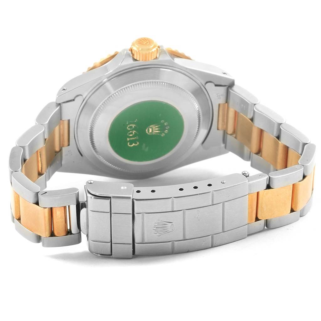 The image shows the back view and clasp of a Rolex Submariner 16613 Men's Steel and Gold (two tone) Grey Dial 16613 Men's Steel and Gold (two tone) Grey Dial watch with the crown and case back visible.