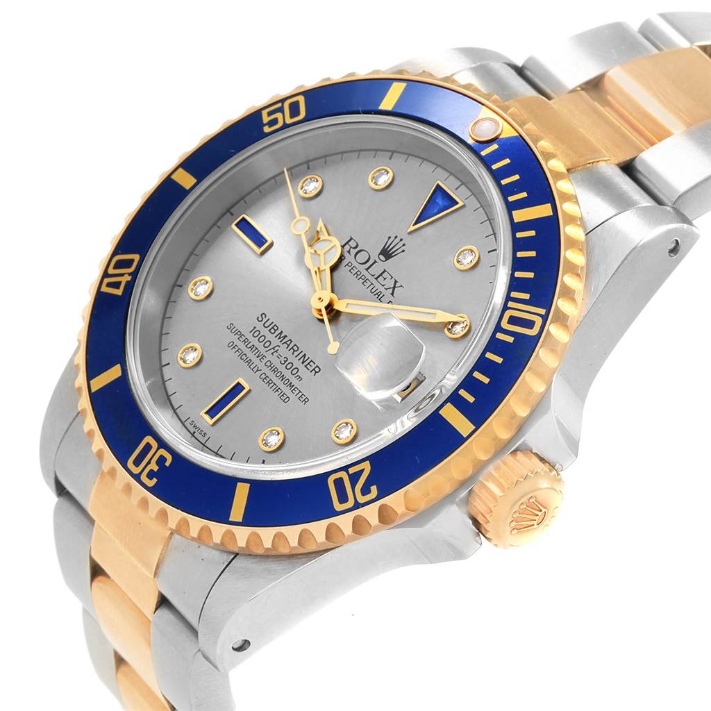 The image shows a close-up angled view of a Rolex Submariner 16613 Men's Steel and Gold (two tone) Grey Dial 16613 Men's Steel and Gold (two tone) Grey Dial, highlighting its bezel, dial, hands, and part of the bracelet.