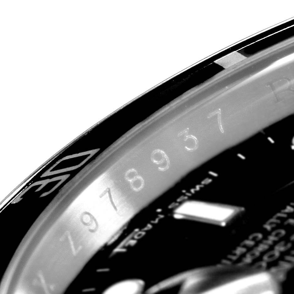 The image shows a close-up of the bezel and part of the dial of a Rolex Submariner 16610 Men's Stainless Steel Silver Dial 16610 Men's Stainless Steel Silver Dial watch.