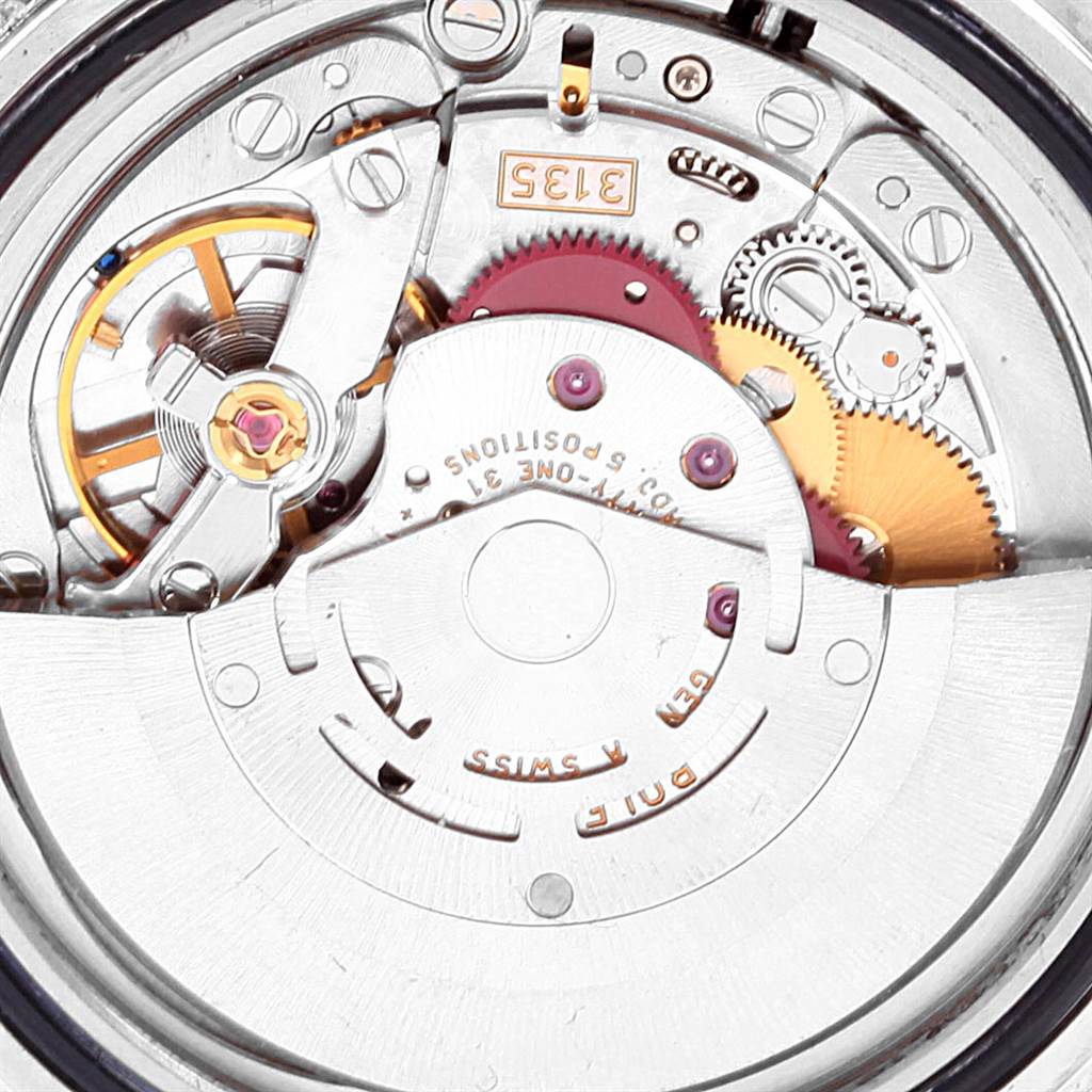 This image shows the internal movement mechanism of a Rolex Submariner 16610 Men's Stainless Steel Black Dial 16610 Men's Stainless Steel Black Dial watch, including gears and the rotor.