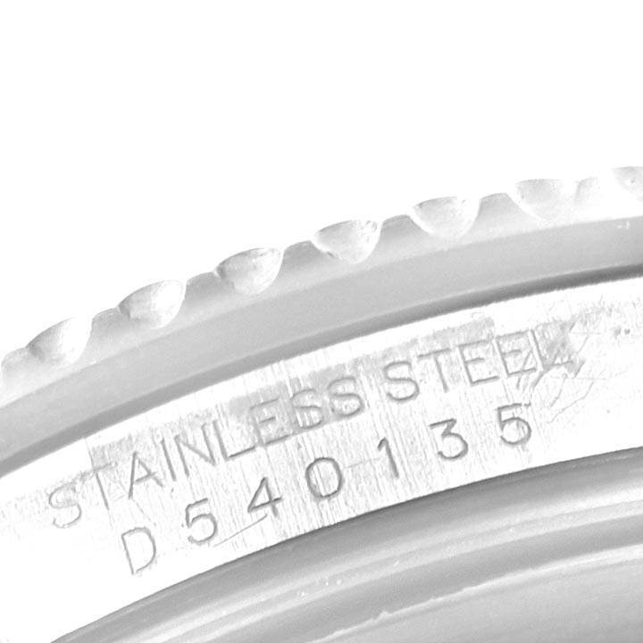 This image shows a close-up angle of the serial number and bezel of a Rolex Submariner 16610 Men's Stainless Steel Black Dial 16610 Men's Stainless Steel Black Dial watch.