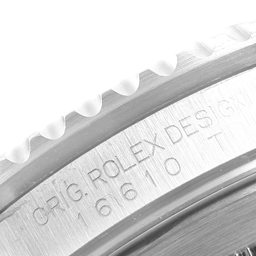 This image shows a close-up of the bezel and engraved model number "16610" on a Rolex Submariner 16610LV Men's Stainless Steel Black Dial 16610LV Men's Stainless Steel Black Dial watch.
