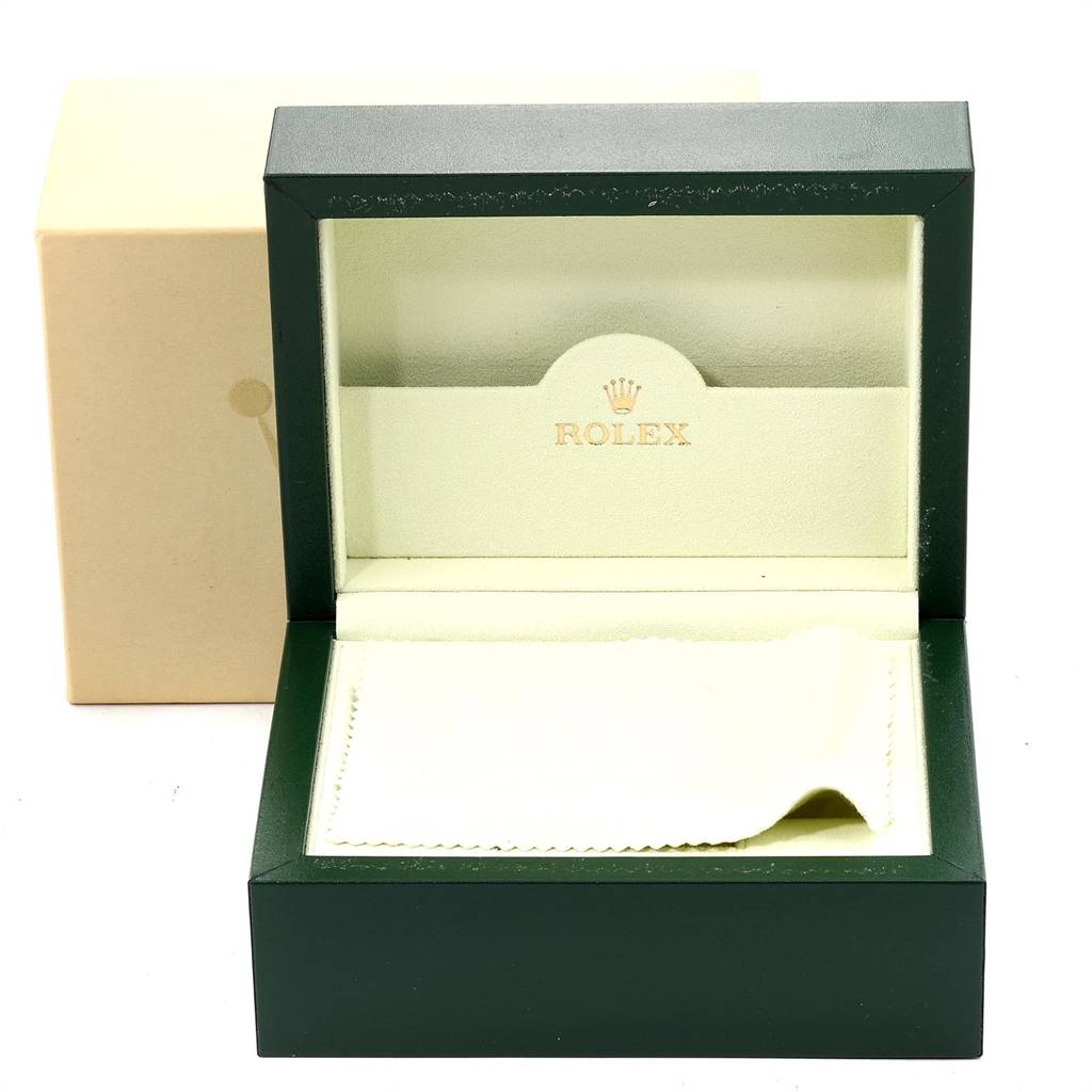 This is an open green Rolex Submariner 16610LV Men's Stainless Steel Black Dial 16610LV Men's Stainless Steel Black Dial watch box, showing its interior and a beige cloth inside, with an outer beige box partially visible.