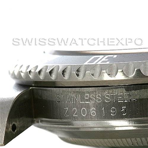 The image shows a close-up side view of the bezel and case, along with the etched serial number of a Rolex Submariner 16610 Men's Stainless Steel Black Dial 16610 Men's Stainless Steel Black Dial watch.