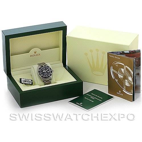 The image shows a Rolex Submariner 16610 Men's Stainless Steel Black Dial 16610 Men's Stainless Steel Black Dial in its box, accompanied by a manual and other official documents, all seen from a front angle.