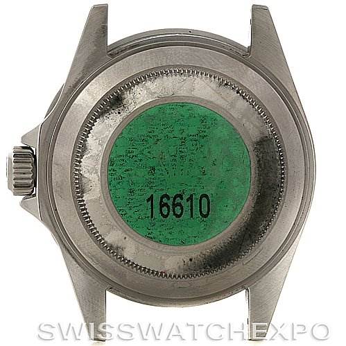 This image shows the back of a Rolex Submariner 16610T Men's Stainless Steel Black Dial 16610T Men's Stainless Steel Black Dial model watch, featuring the case back with a green sticker displaying the number 16610.