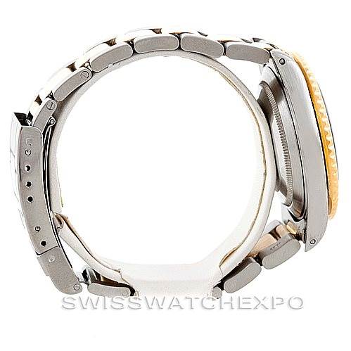 This image shows a side view of the Rolex Submariner 16613 Men's Steel and Gold (two tone) Blue Dial 16613 Men's Steel and Gold (two tone) Blue Dial watch, highlighting its metal band, side profile, and the crown.